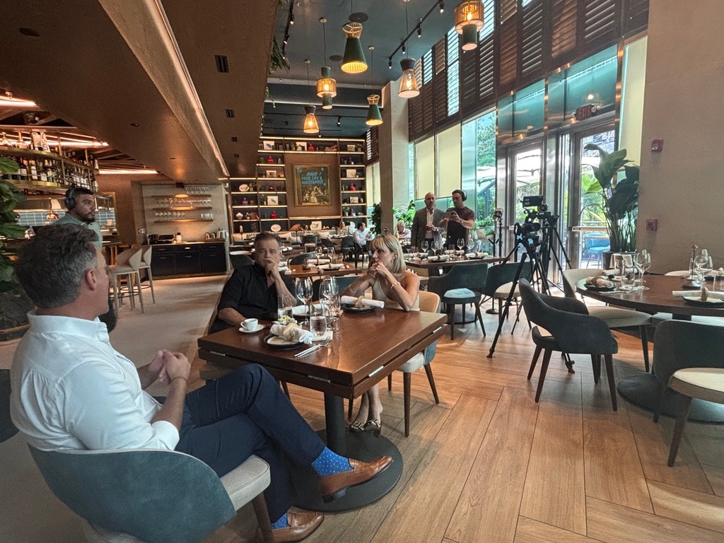 A hospitality interior set up for a press segment, partnership marketing and visibility in flight.